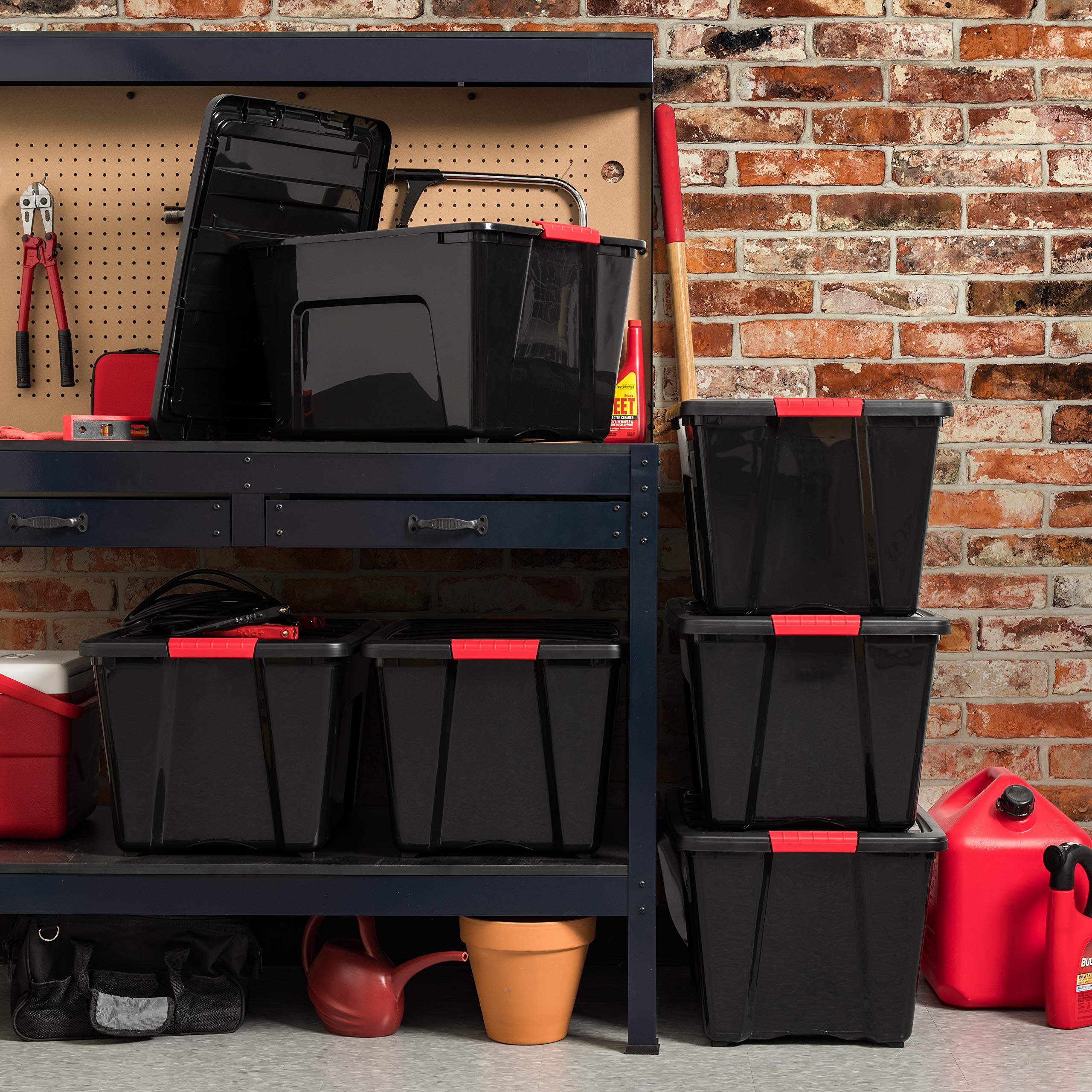 Black IRIS USA garage storage bin blends with workshop shelves.