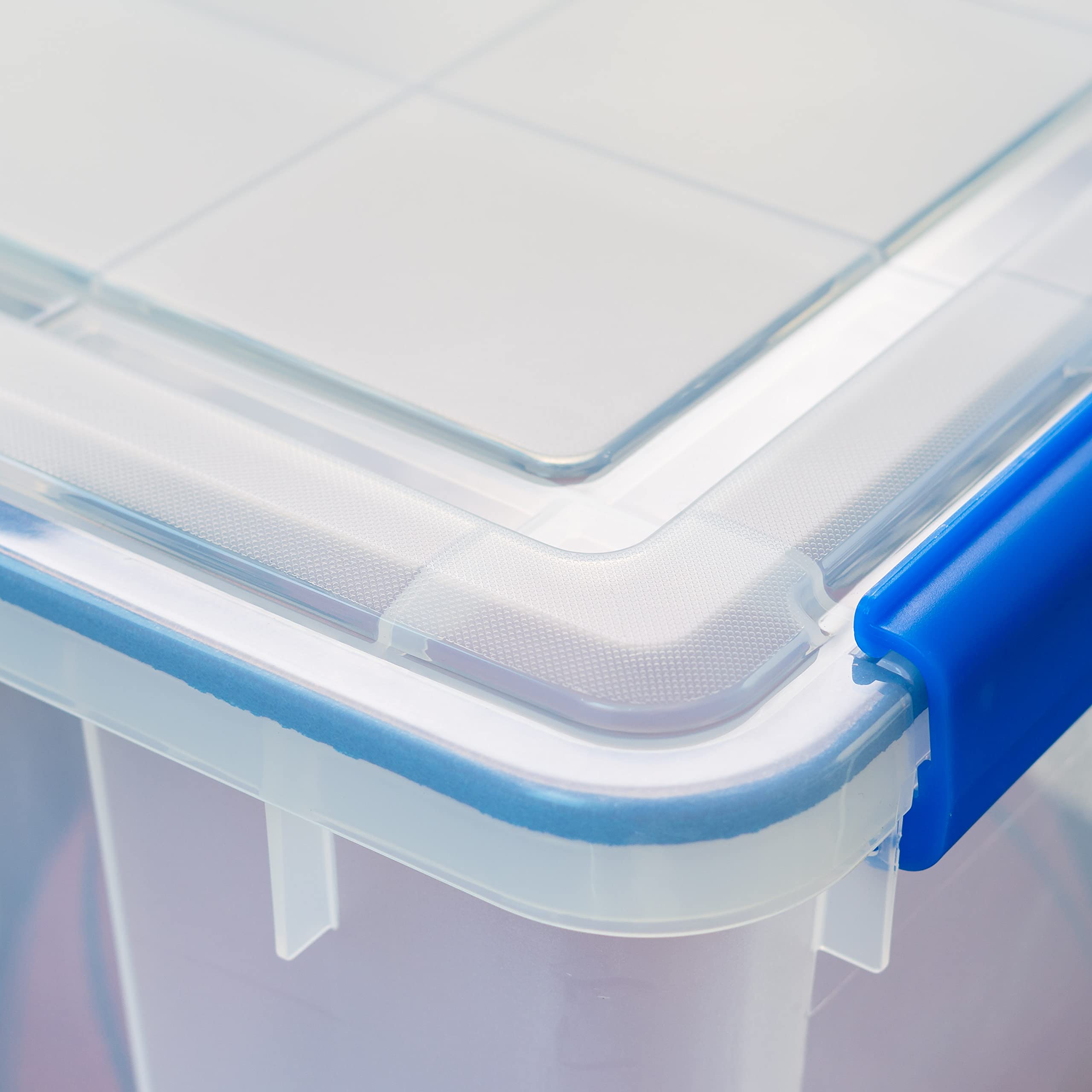 IRIS USA WeatherPro 74 Qt bin contents storage keeps clothes and gear organized.