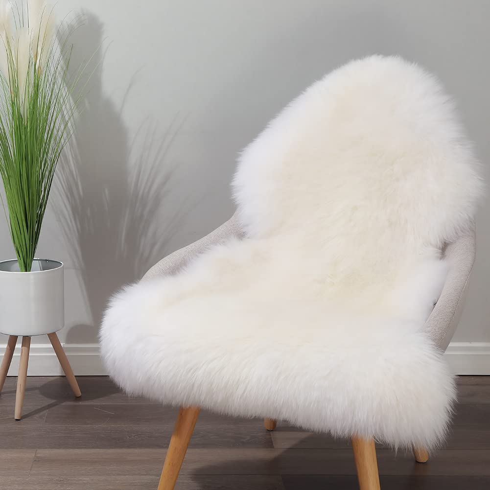 IRIWOOL sheepskin rug draped on a chair for plush seating.