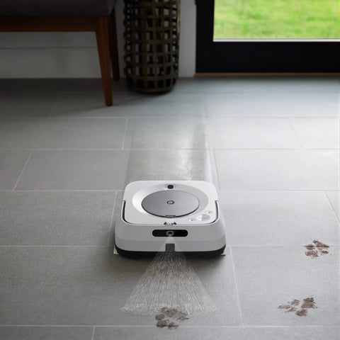 iRobot Braava jet m Series pad close-up shows wicking fibers breaking sticky messes.