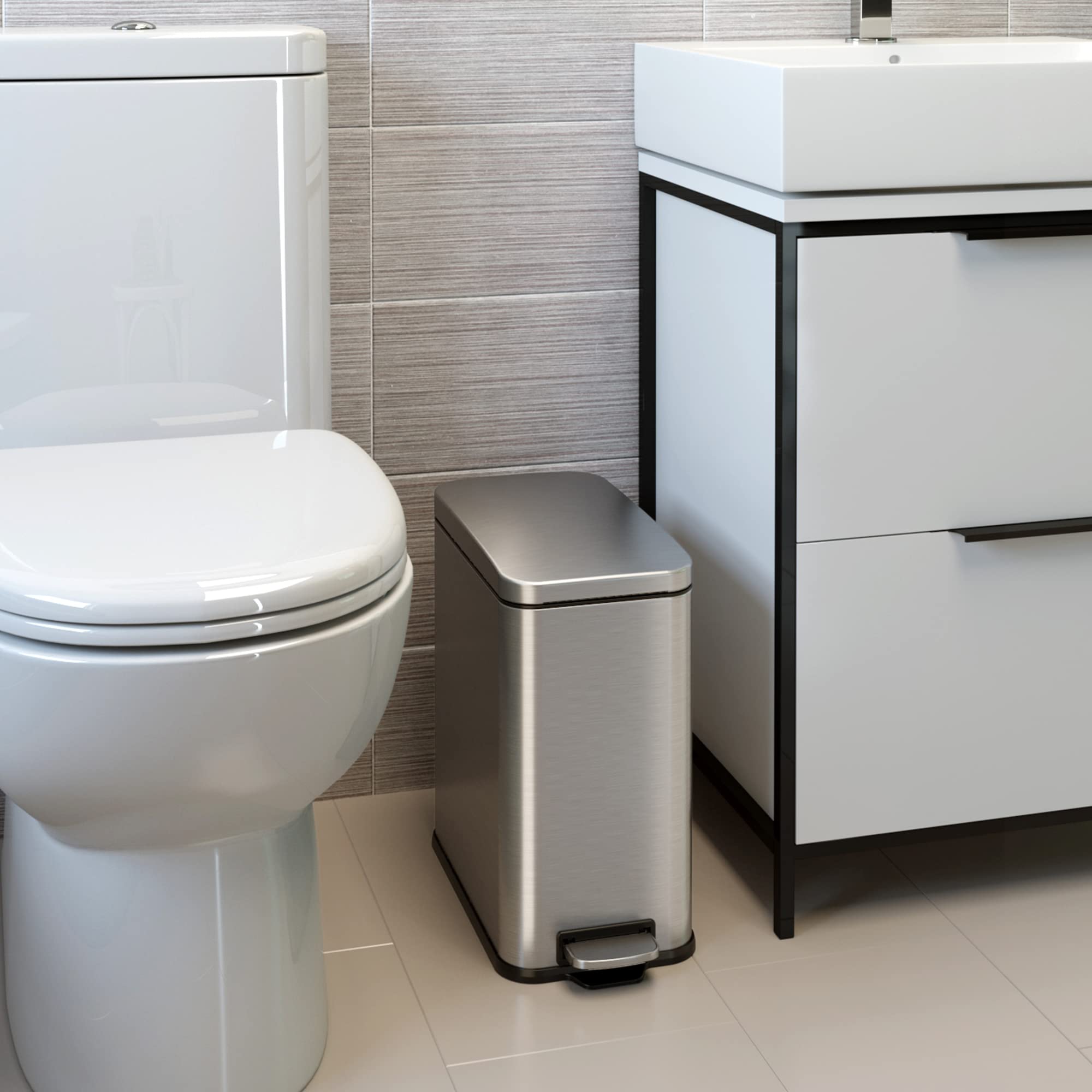 iTouchless slim-gap wastebasket fits between toilet and vanity for efficient space use.