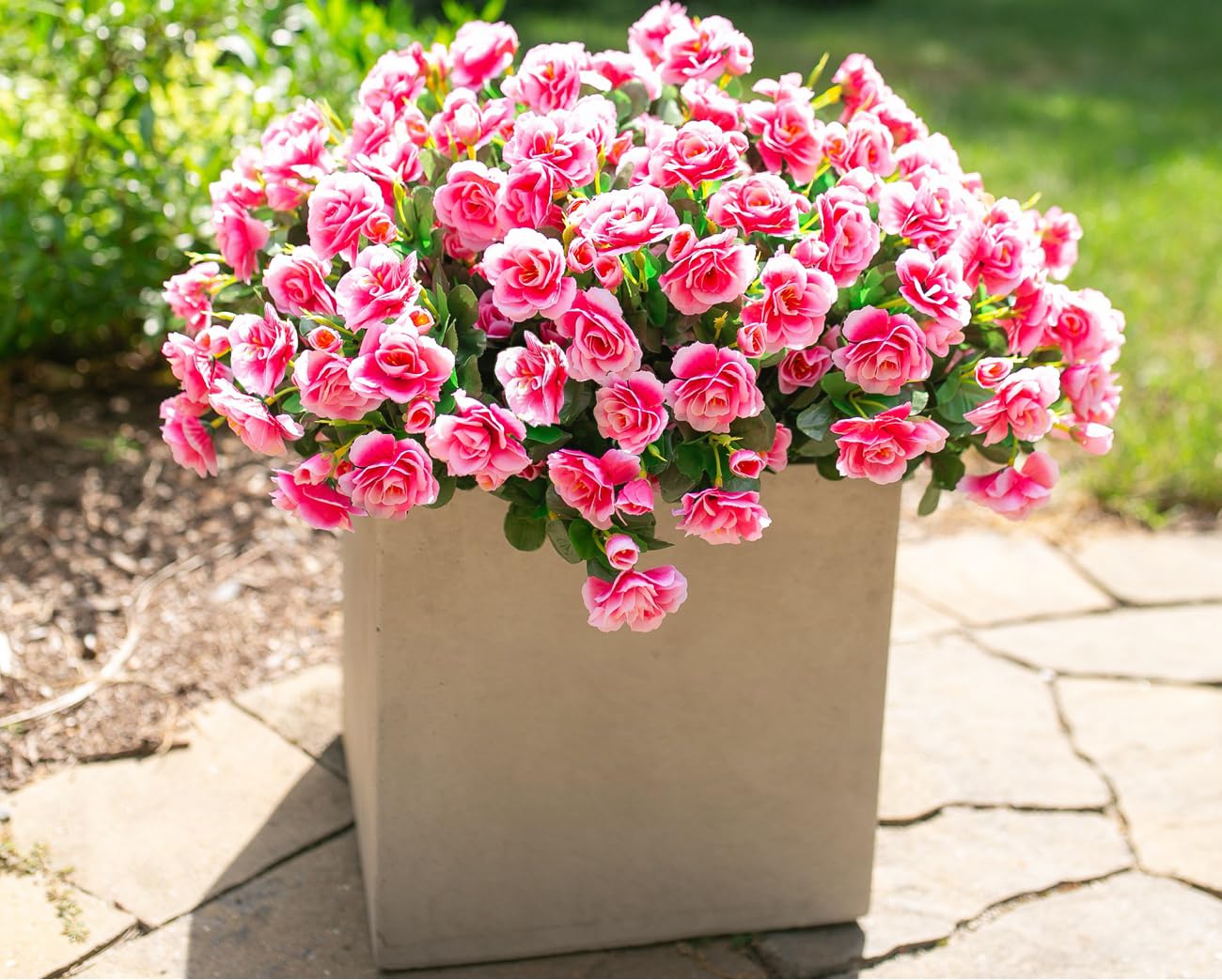 Ivydale faux camellia pink closeup shows lifelike texture and color.