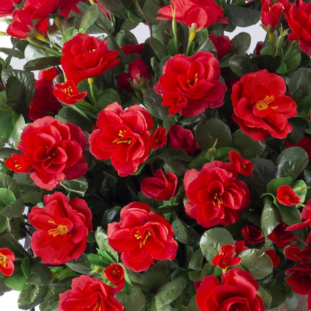 Ivydale three-bundle faux camellias create a lush porch focal point.