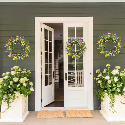 J'FLORU wreath styled as wall decor with vibrant daisies and lavender