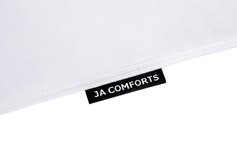 JA COMFORTS 39oz fill-weight pillow demonstrates substantial support.
