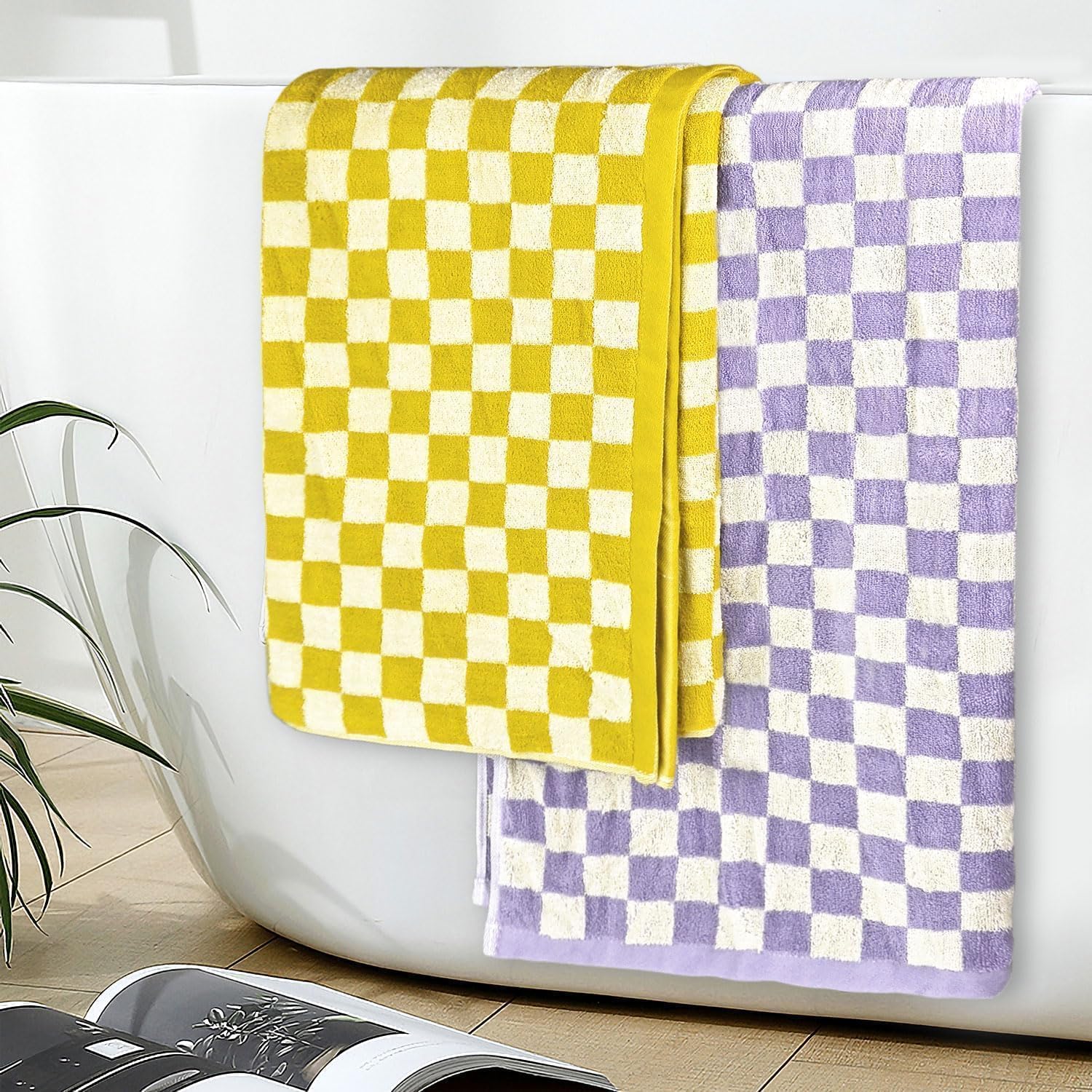 Jacquotha towel set includes two decorative towels with bold yellow-lilac pattern.