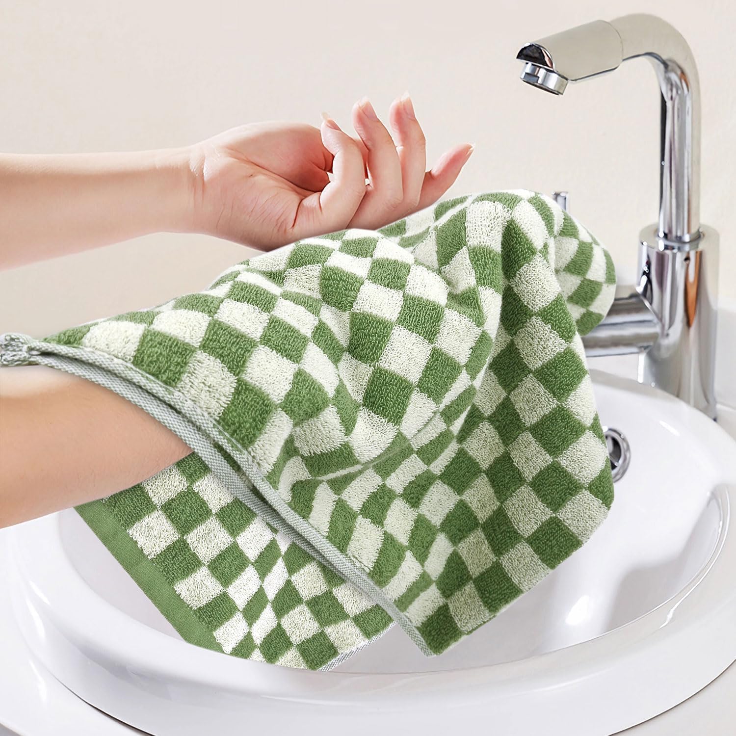 Jacquotha checkered design towels add subtle decor to bathroom spaces.