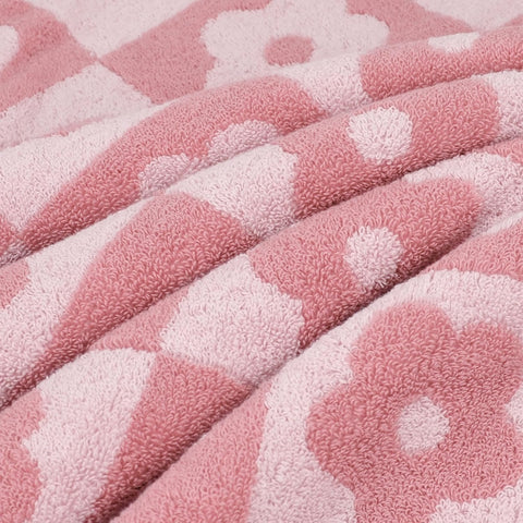 Jacquotha towels close-up emphasizing dense loops and premium weave.