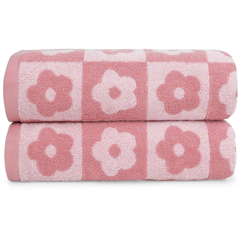 Jacquotha checkered floral towels folded, showing plush texture for quick drying.