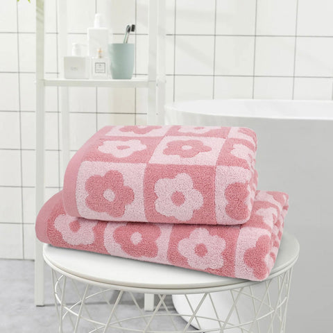 Jacquotha towels spread on bench displaying generous size for daily use.