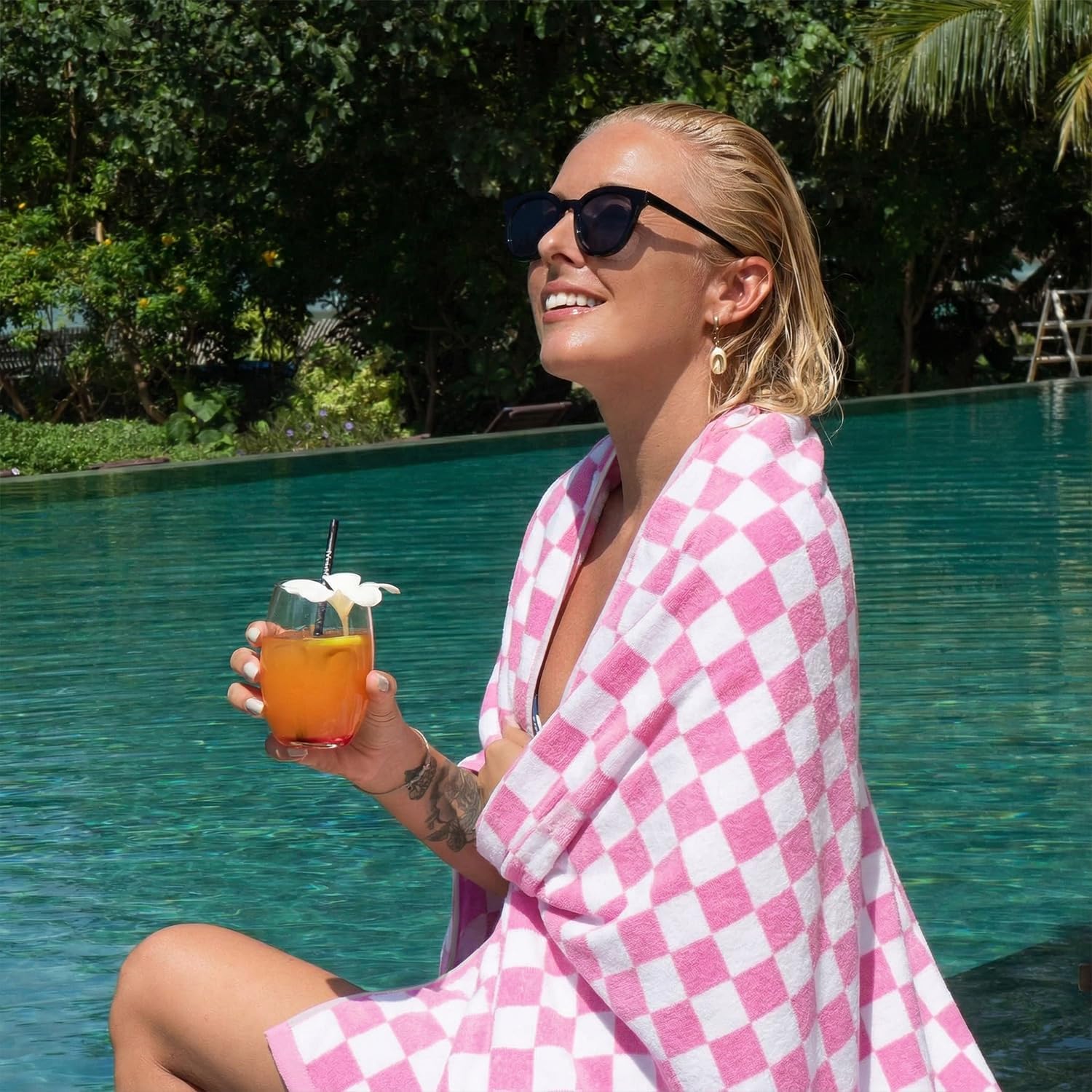 Jacquotha pink checkered towel folded for travel with quick-dry cotton