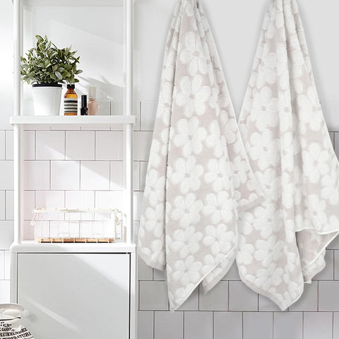 Jacquotha towels open view shows the floral jacquard pattern in light beige