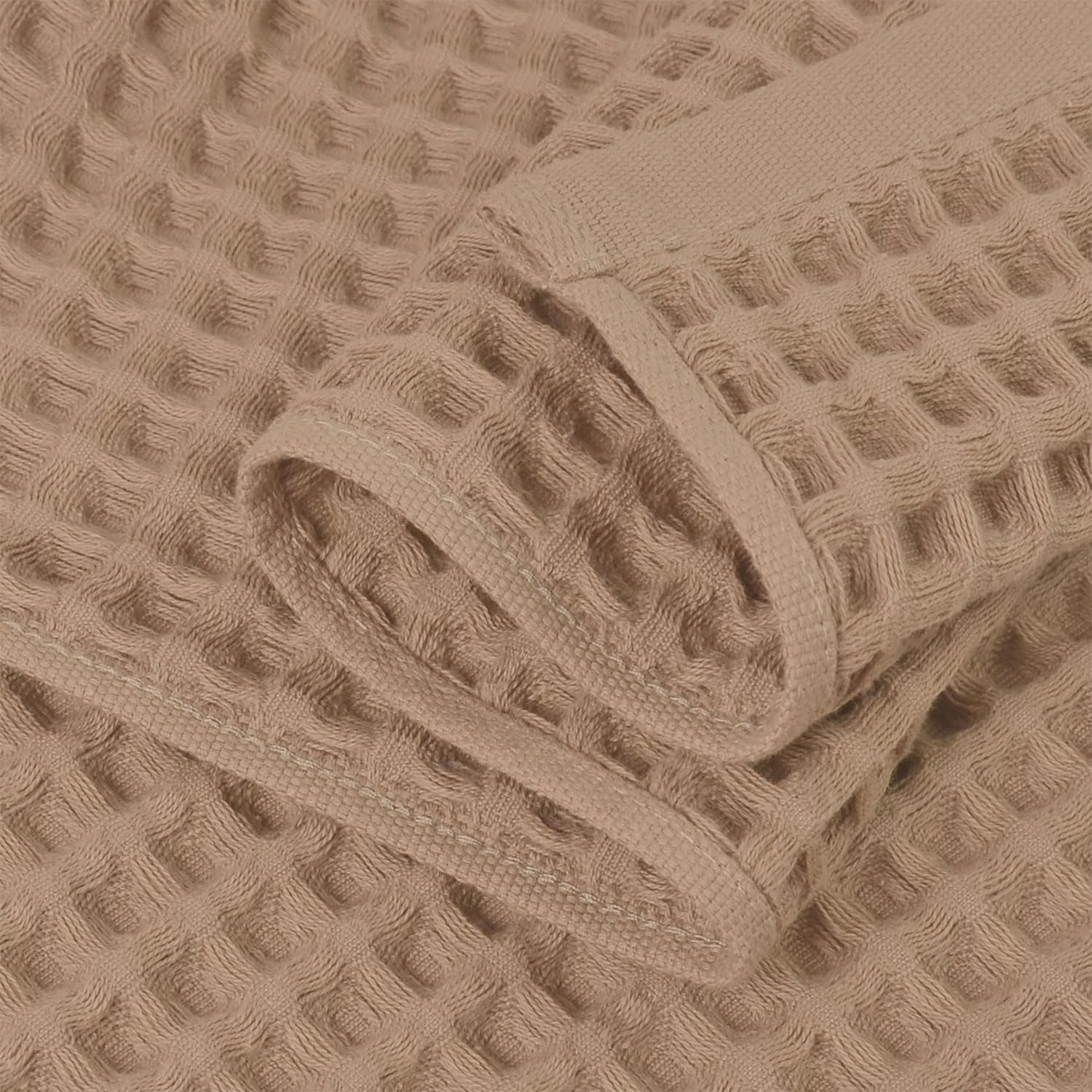 Jacquotha waffle towels draped on rack, quick-dry design in action.