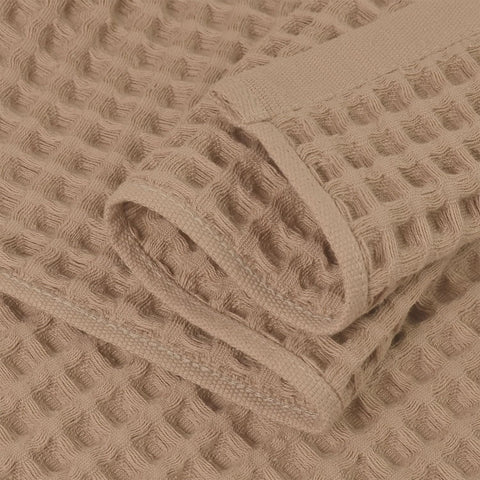 Jacquotha waffle towels draped on rack, quick-dry design in action.