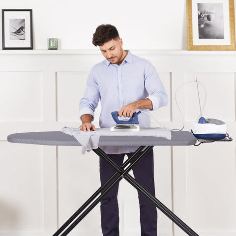 Jakeefud ironing board with silicone padded iron rest for wrist comfort and heat protection.