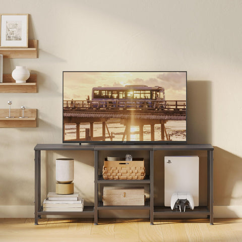 JARHETUN entertainment center with open shelves provides easy access to consoles and players.
