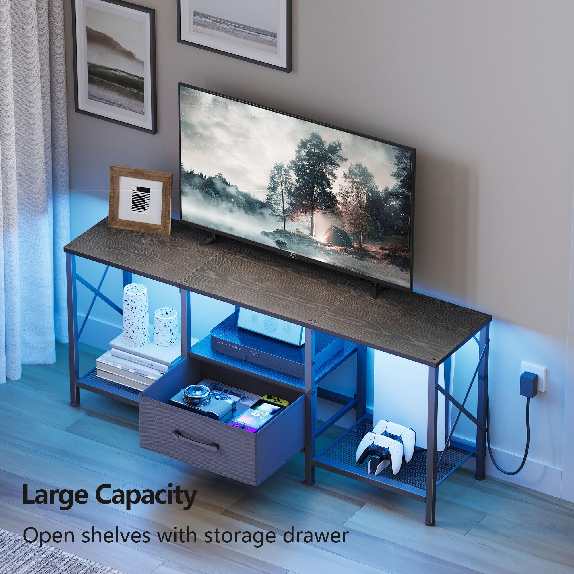 Fabric drawer on the JARHETUN stand conceals remotes and cables