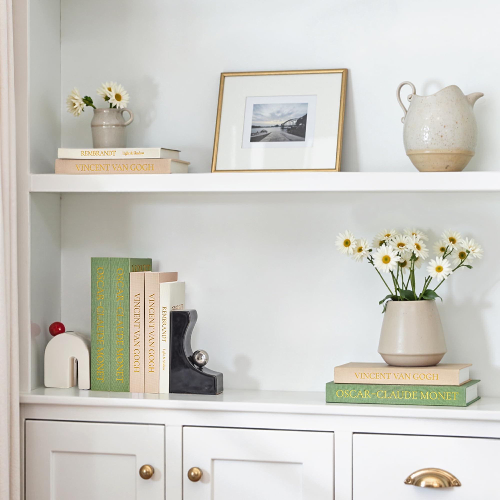 JARLINK coffee table display with faux books invites touch and conversation.