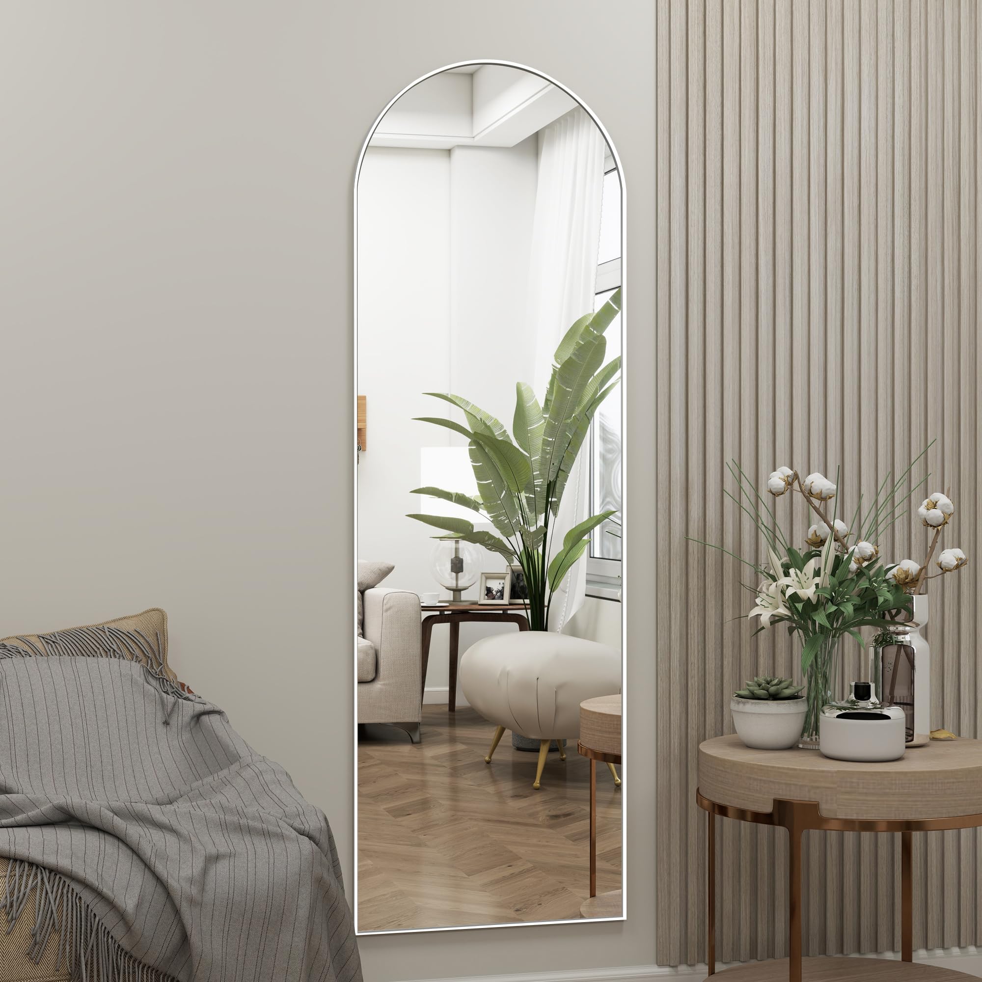 JAWGLOW arched mirror shows easy door hanging with adjustable hooks.