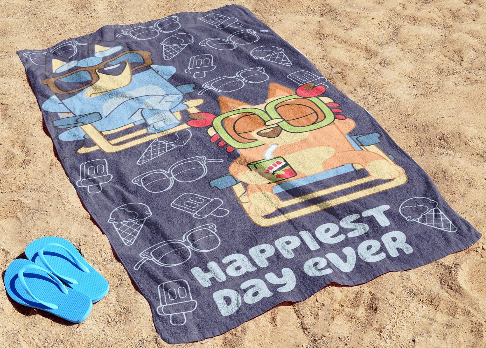 Jay Franco Bluey & Bingo towel laid flat, 28 by 58 inches.