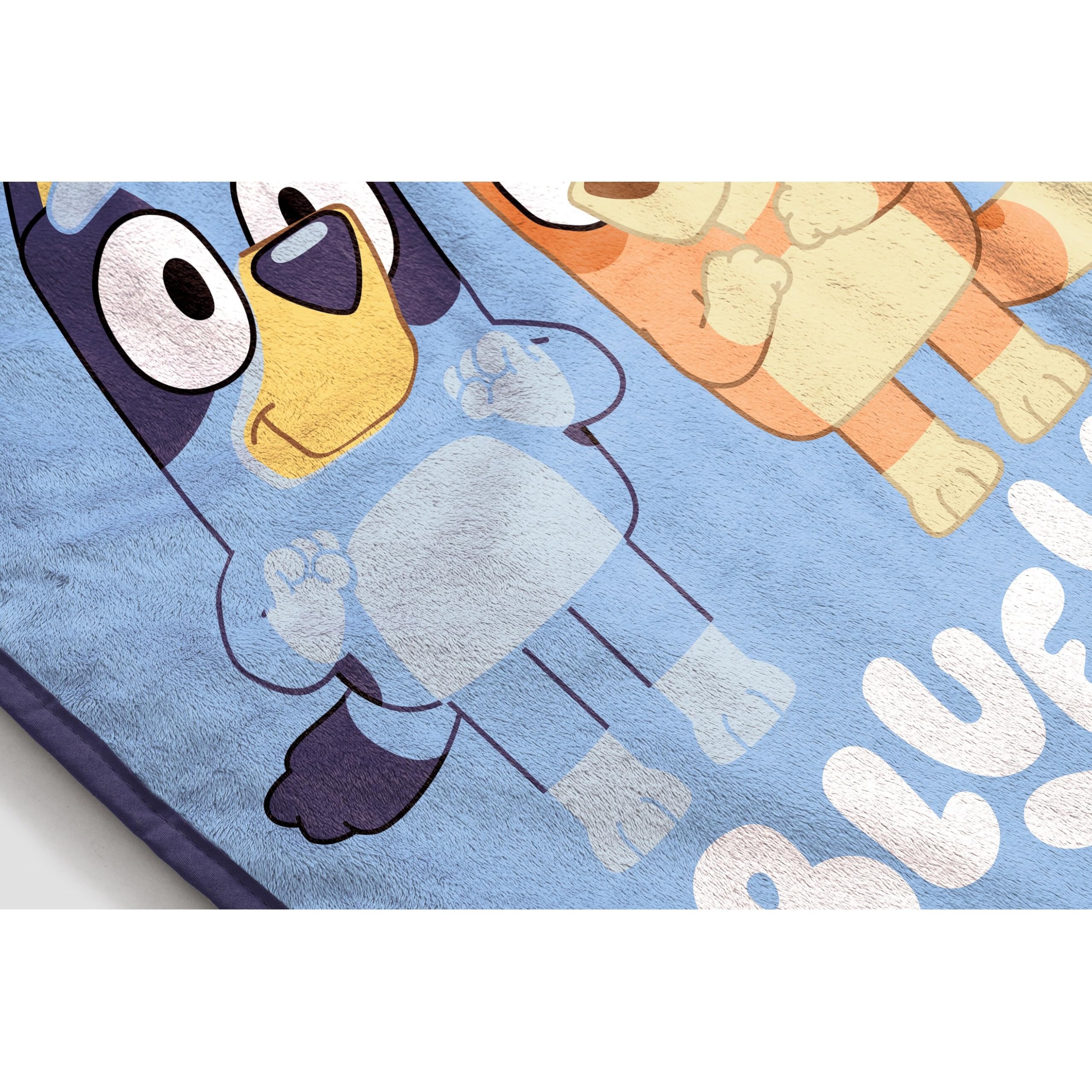 Jay Franco Bluey throw rolled for easy storage and travel readiness.