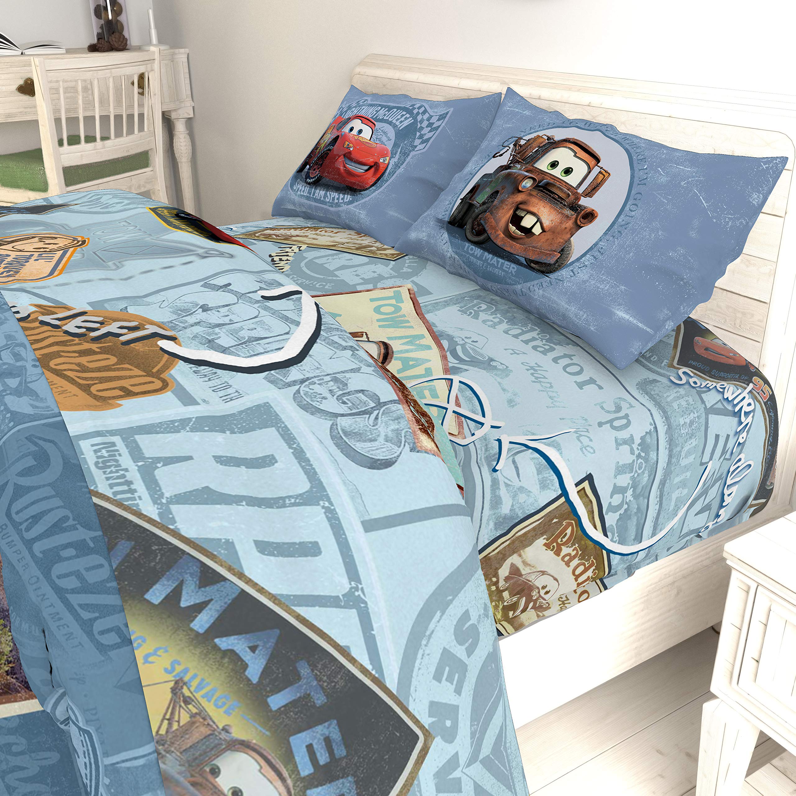 Jay Franco Cars Tune Up radiator springs artwork enhances themed bedroom.