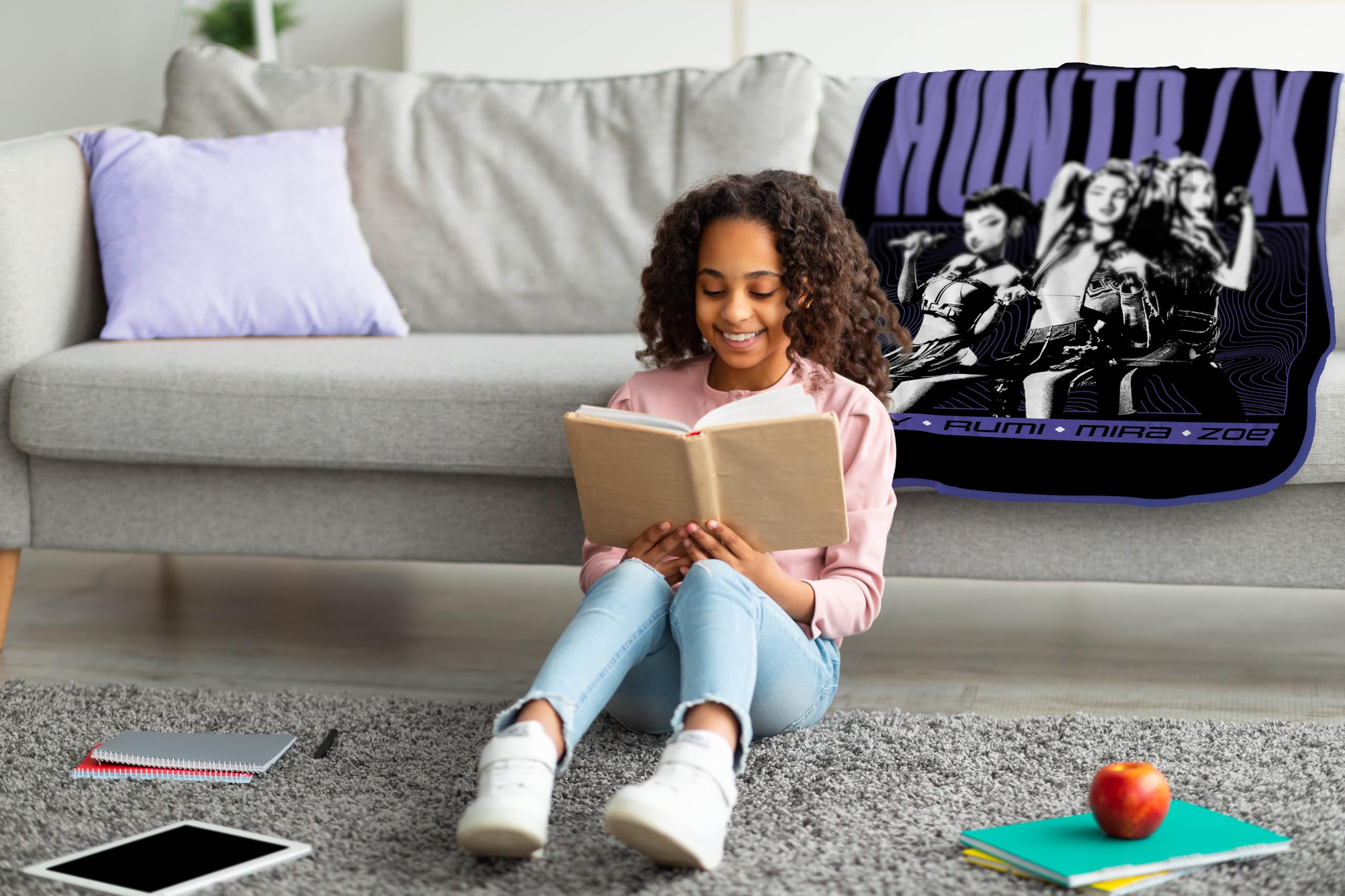 Jay Franco Demon Hunters throw blanket on the couch adds soft warmth for movie nights.
