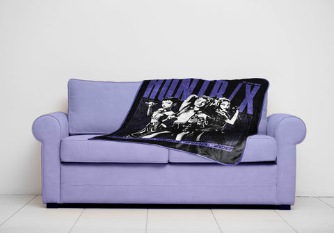 Jay Franco Huntrix throw draped on bed demonstrates cozy layering for Bedtime Comfort.