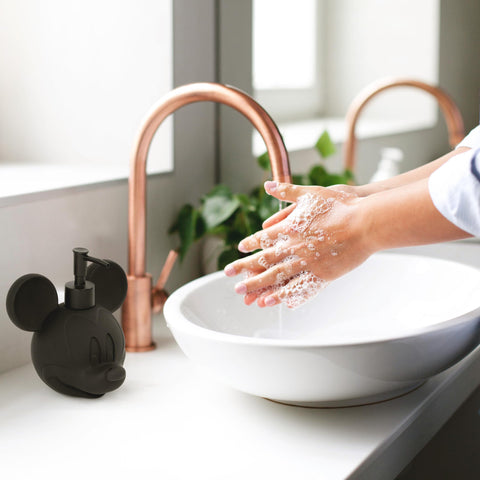 Versatile dispenser suitable for dish soap, hand sanitizer, or lotion on a desk.