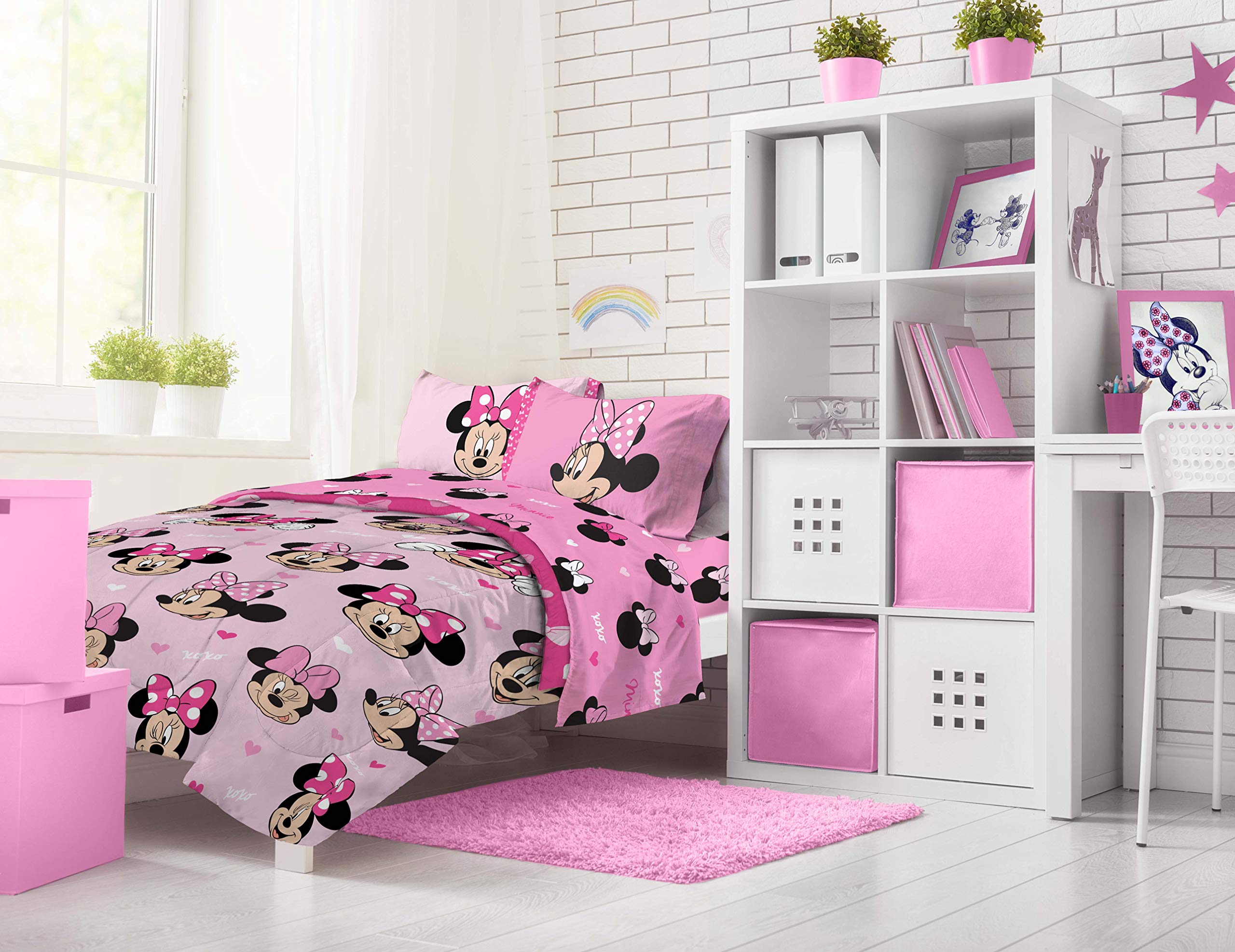 Kid-friendly Minnie Mouse room setup with colorful bedding