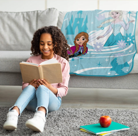 Jay Franco Frozen blanket draped on the sofa enhances decor with playful blue hues.