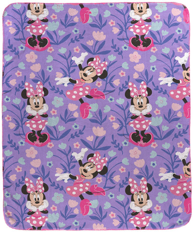 Jay Franco Minnie Mouse plush throw with pink polka dots, a cozy bed companion