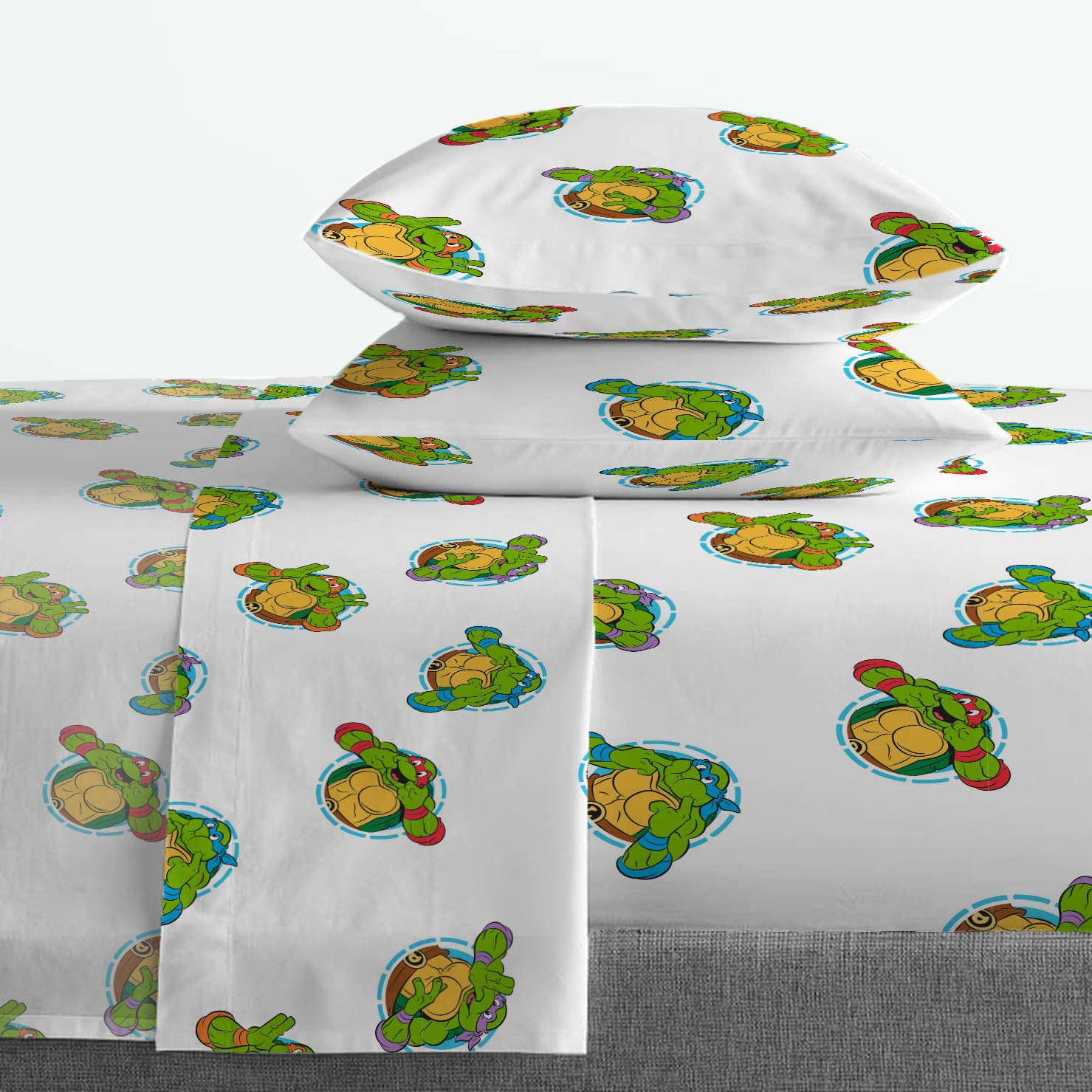 Jay Franco TMNT green bricks design closeup shows bold characters on black background.