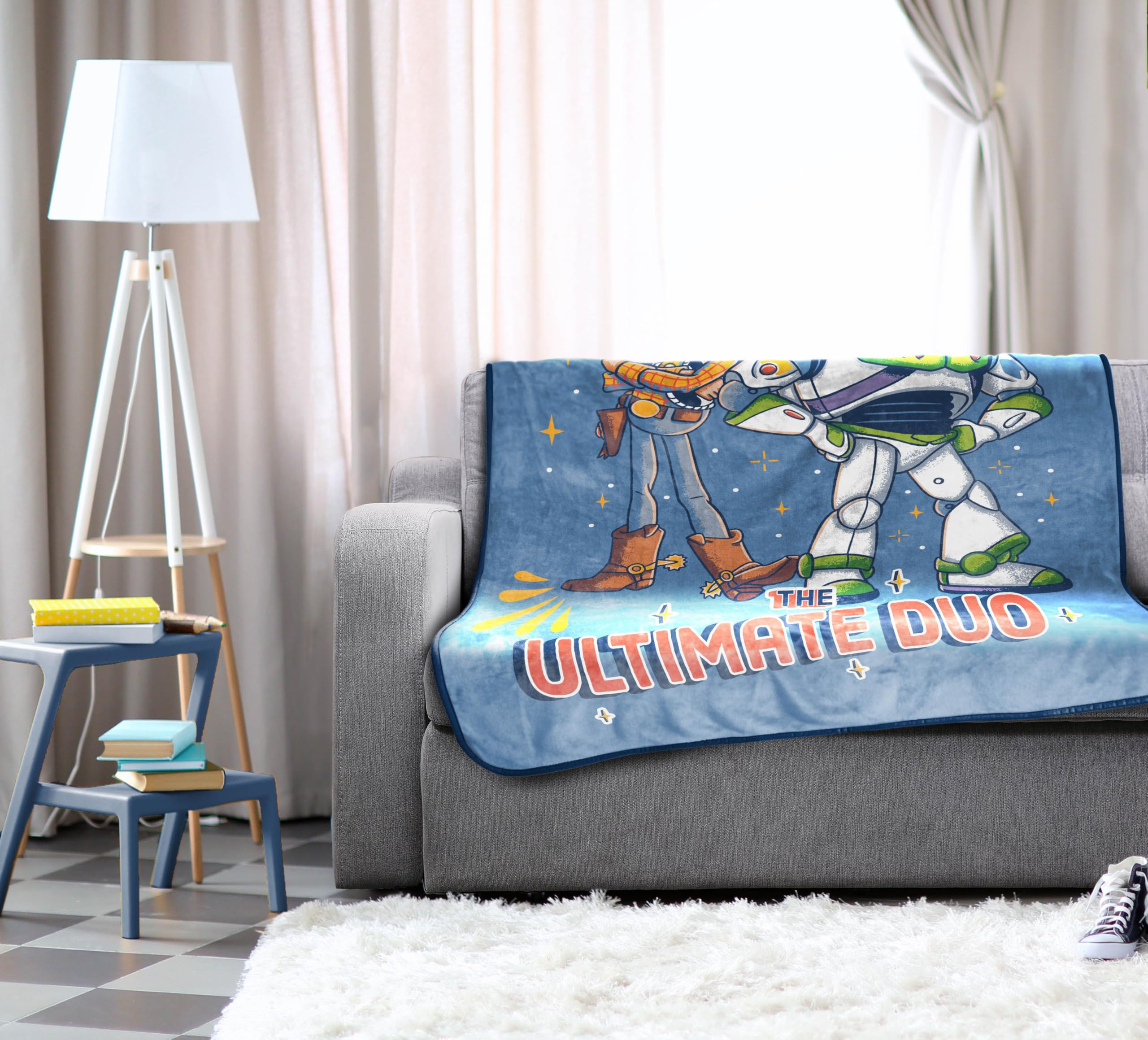 Jay Franco Toy Story fleece throw placed on a couch for cozy lounging.