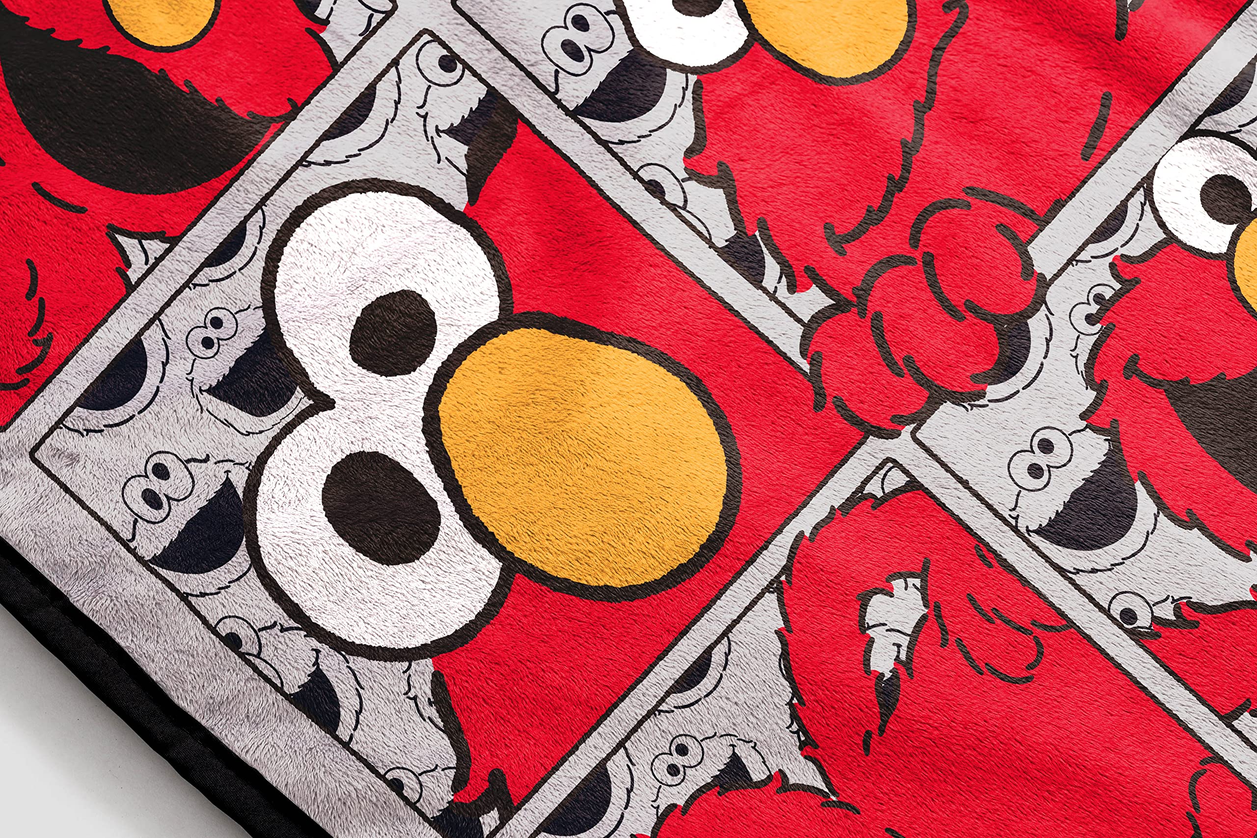 Jay Franco Sesame Elmo throw rolled for storage and travel convenience