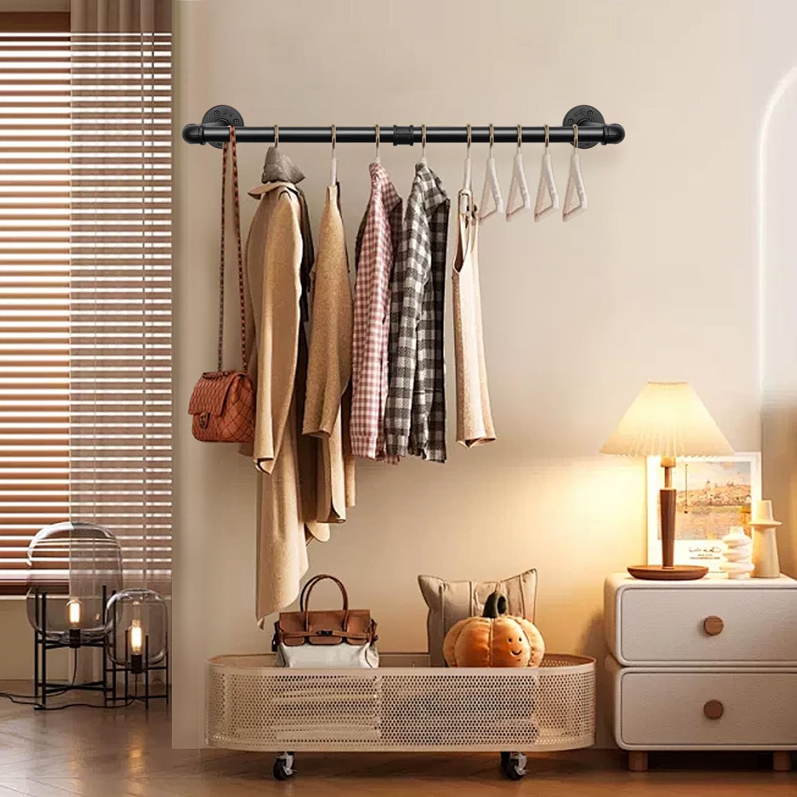 Jeasor rack with hanging clothes in a softly lit space.