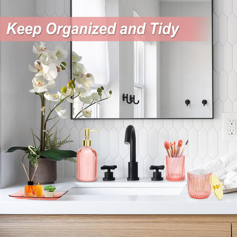 Jenseits pink bathroom decor balances function and feminine style.