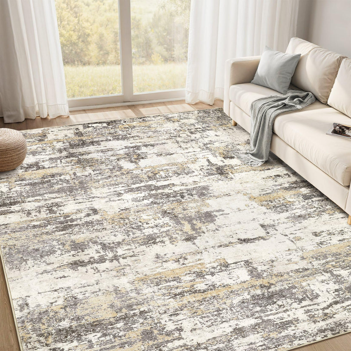 Jessibou area rug with abstract pattern adds a calming focal point to the living room