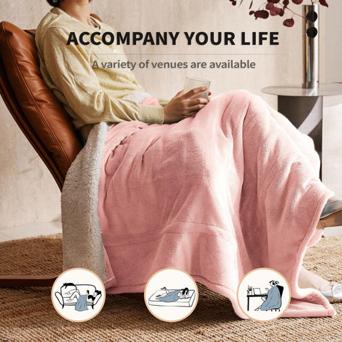JET'S HOME heated blanket draped on a sofa demonstrates generous warmth area.