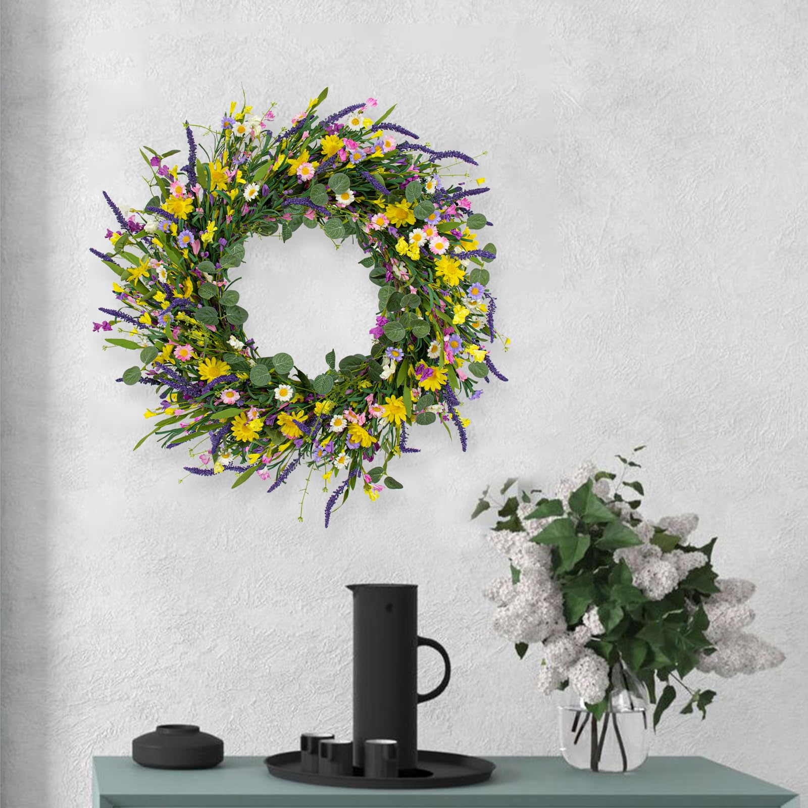 J'FLORU wreath on an outdoor porch adding spring color to exterior decor.