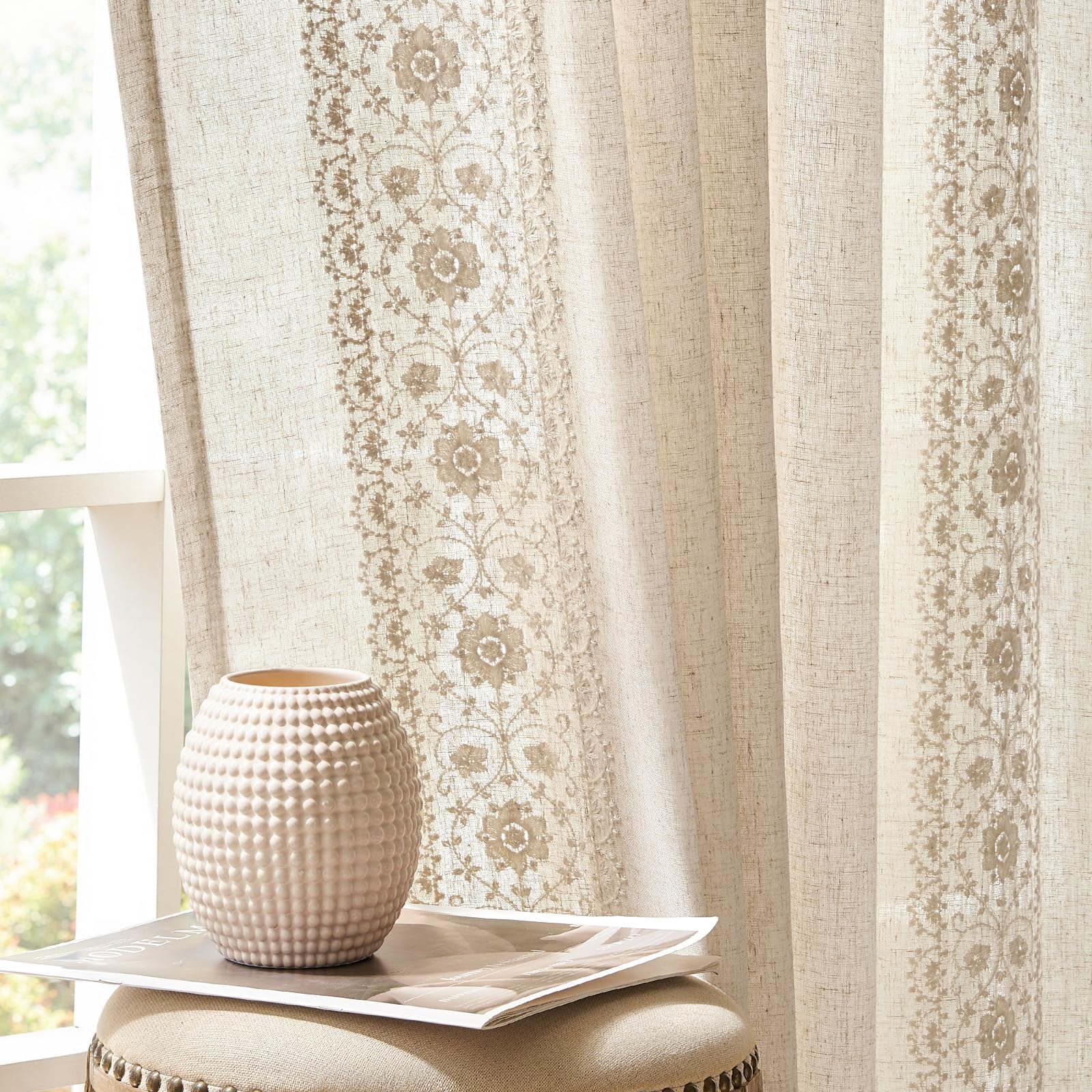Jinchan Weslie curtains with ivory floral embroidery add vintage charm to the living room.
