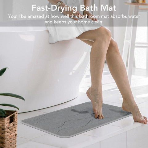 JIZEUO quick-drying bath mat reduces moisture after a shower.