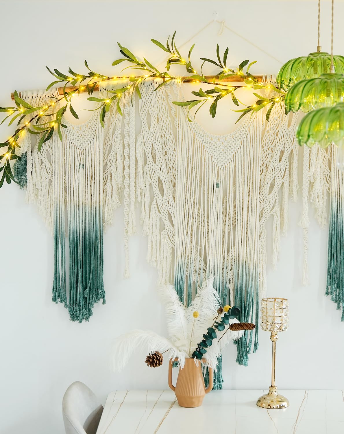 JMEXSUSS olive garland used as wedding backdrop with warm lighting