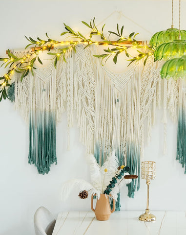 JMEXSUSS olive garland used as wedding backdrop with warm lighting