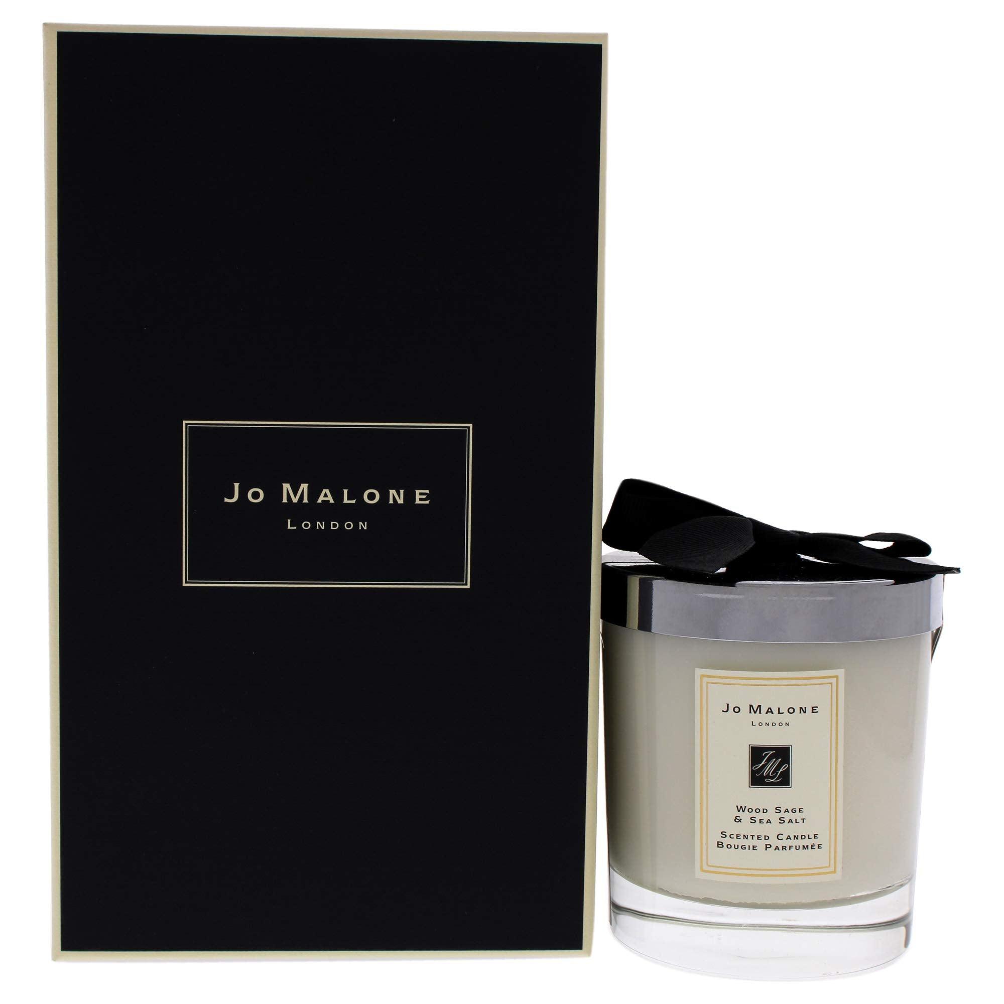 Jo Malone Wood Sage and Sea Salt candle in the jar enhances coastal luxury ambiance.