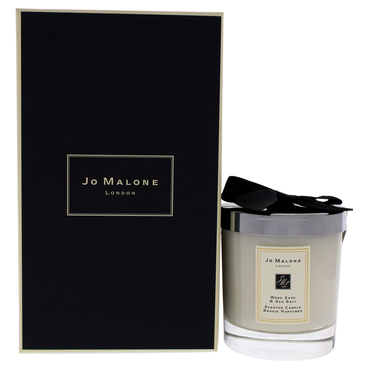 Jo Malone Wood Sage and Sea Salt candle in the jar enhances coastal luxury ambiance.