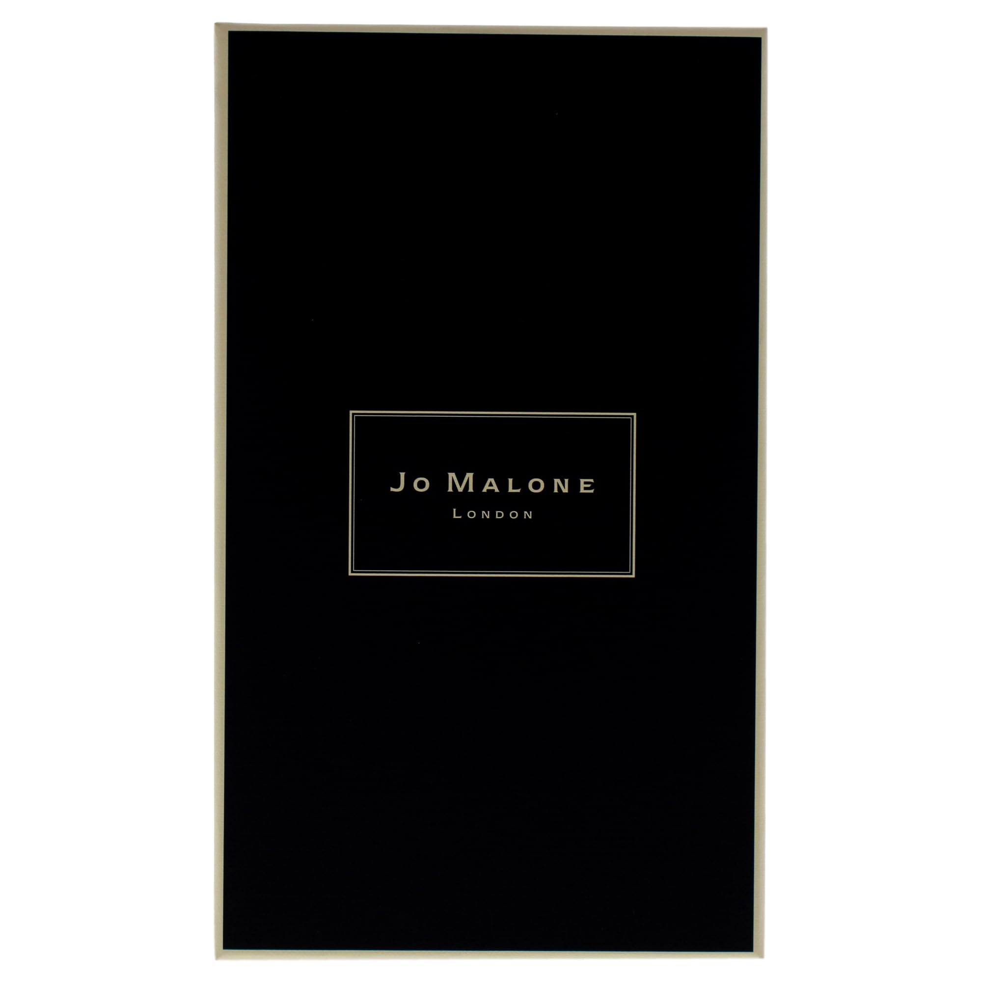 Jo Malone Wood Sage and Sea Salt candle in a room boosts calm coastal vibe.