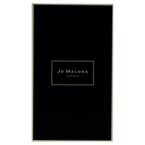 Jo Malone Wood Sage and Sea Salt candle in a room boosts calm coastal vibe.