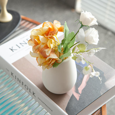 JOJUNO white bud vases offer versatile centerpiece options for rooms.