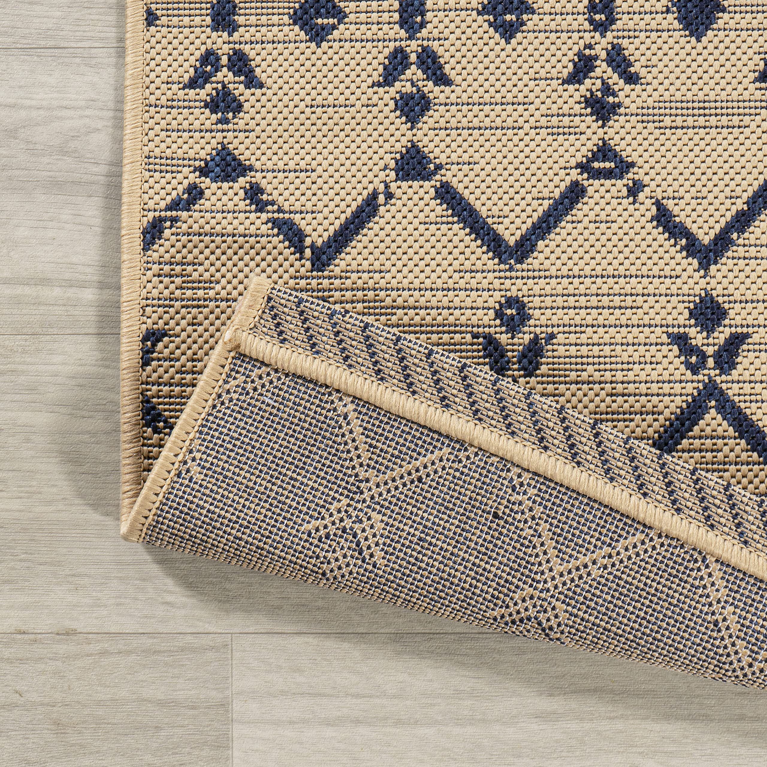 Jonathan Y Ourika flatweave polypropylene construction for durable easy-care.